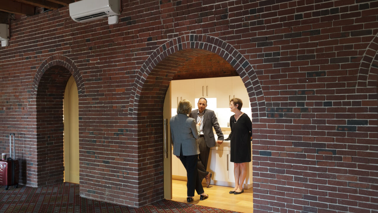 Barr Foundation trustees talking causally.