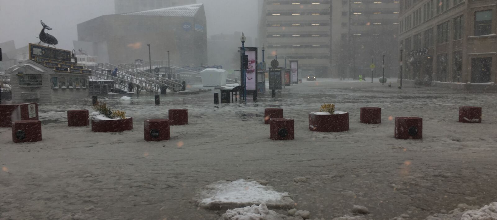Downtown Boston is flooded in snow and water.