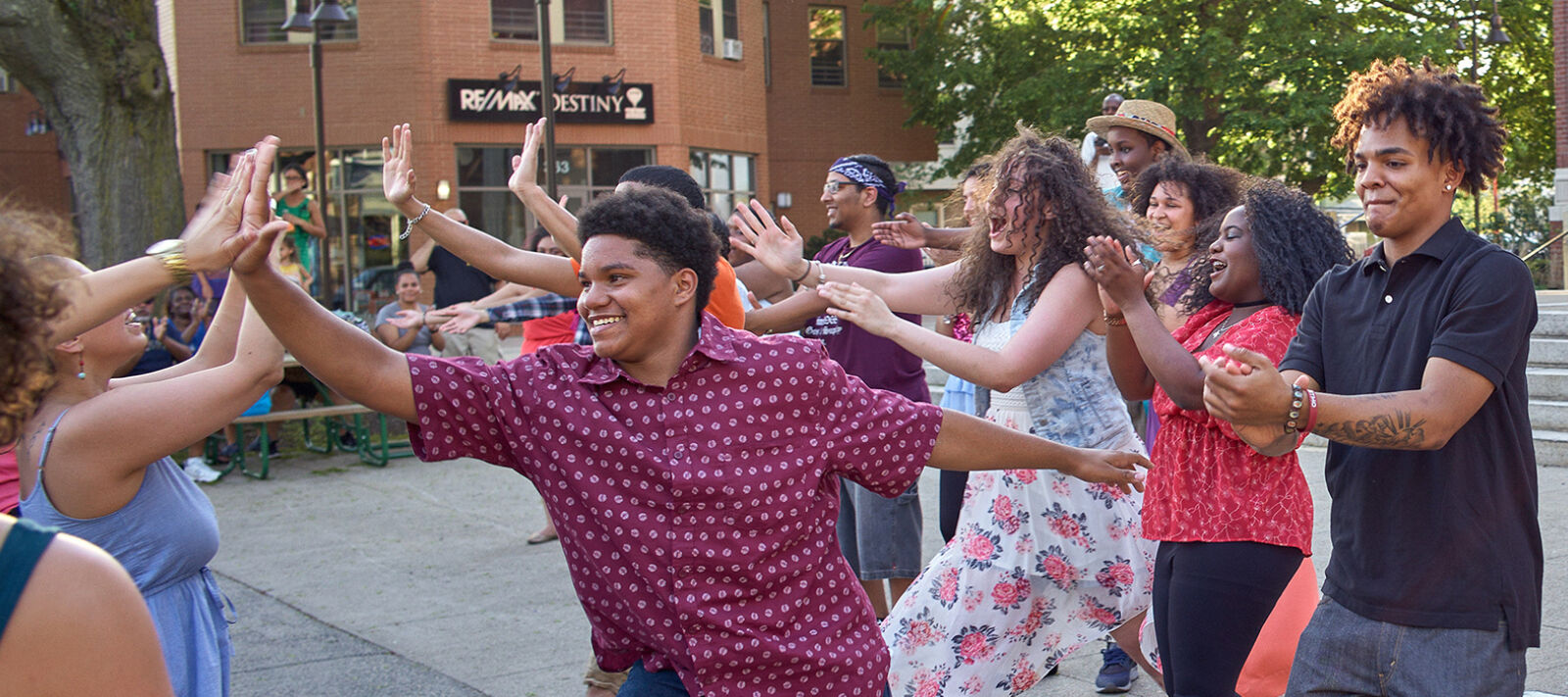 Young people high-five after their performance.