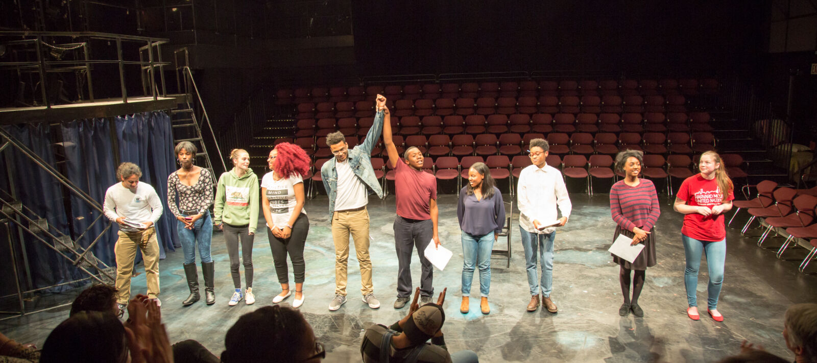 Teenagers take a bow on the stage.