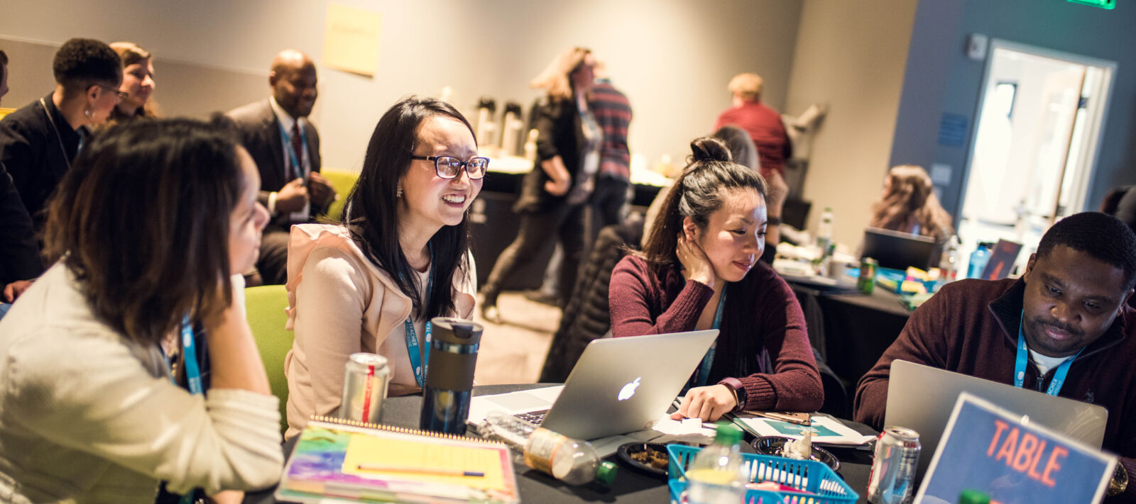 Teachers work together at a round table.