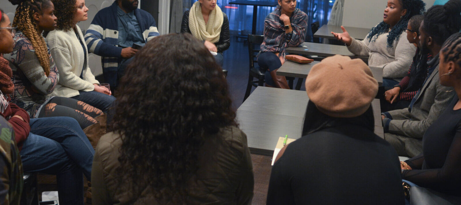 Teachers listen to each other in a group.