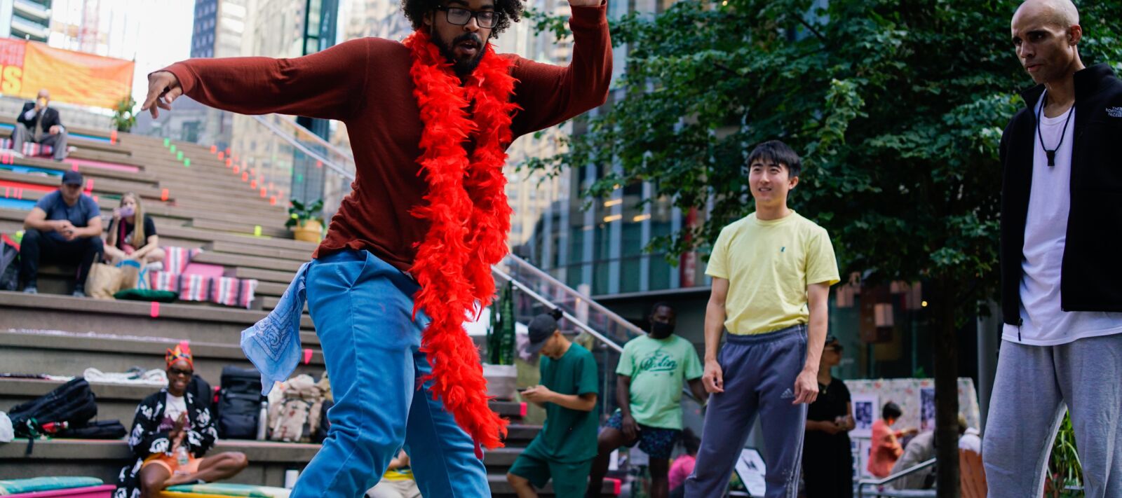 A man dances on the street in downtown Boston.