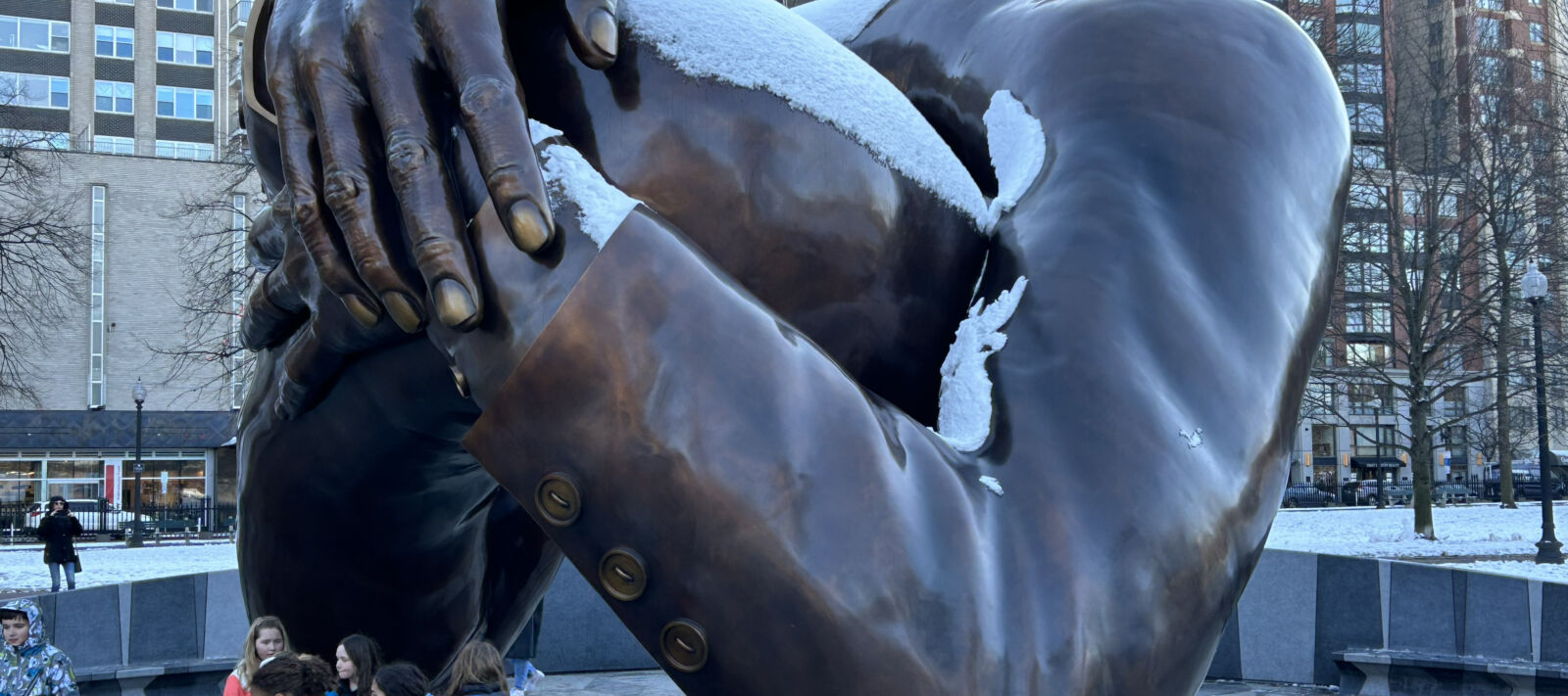 The Embrace monument covered in snow in downtown Boston.
