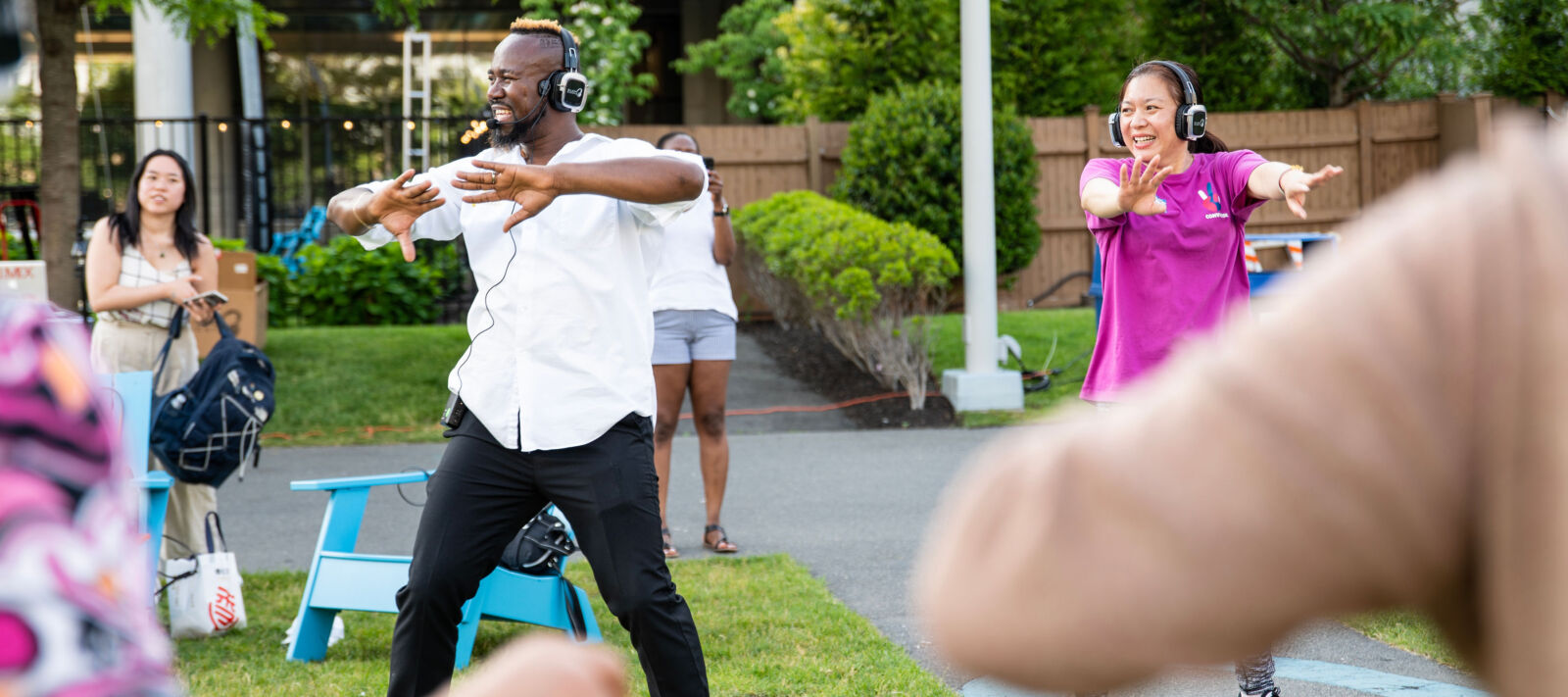 A group of people outside dancing.